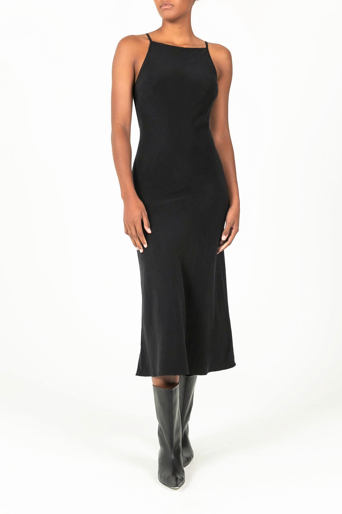Ecomm Model wearing the Gisele Bias Cut Dress in Stretch Twill, with a fabric that hugs and flatters the natural curves of any figure while the geometric bust line is relaxed yet precise.