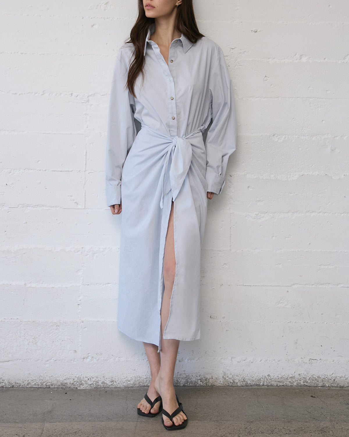 Model wearing L.A. Button-Down Wrap Midi Dress in stretch cotton, styled with a tailored wrap silhouette and relaxed shirt-inspired fit.