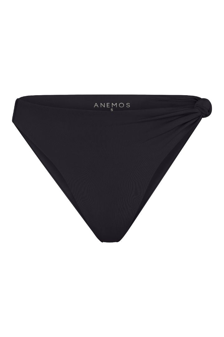 The Knot Asymmetric Midi Bikini Bottom on a white background, featuring a high-waist, high-cut leg, and knot detail at the hip for a retro-inspired, sculptural look.