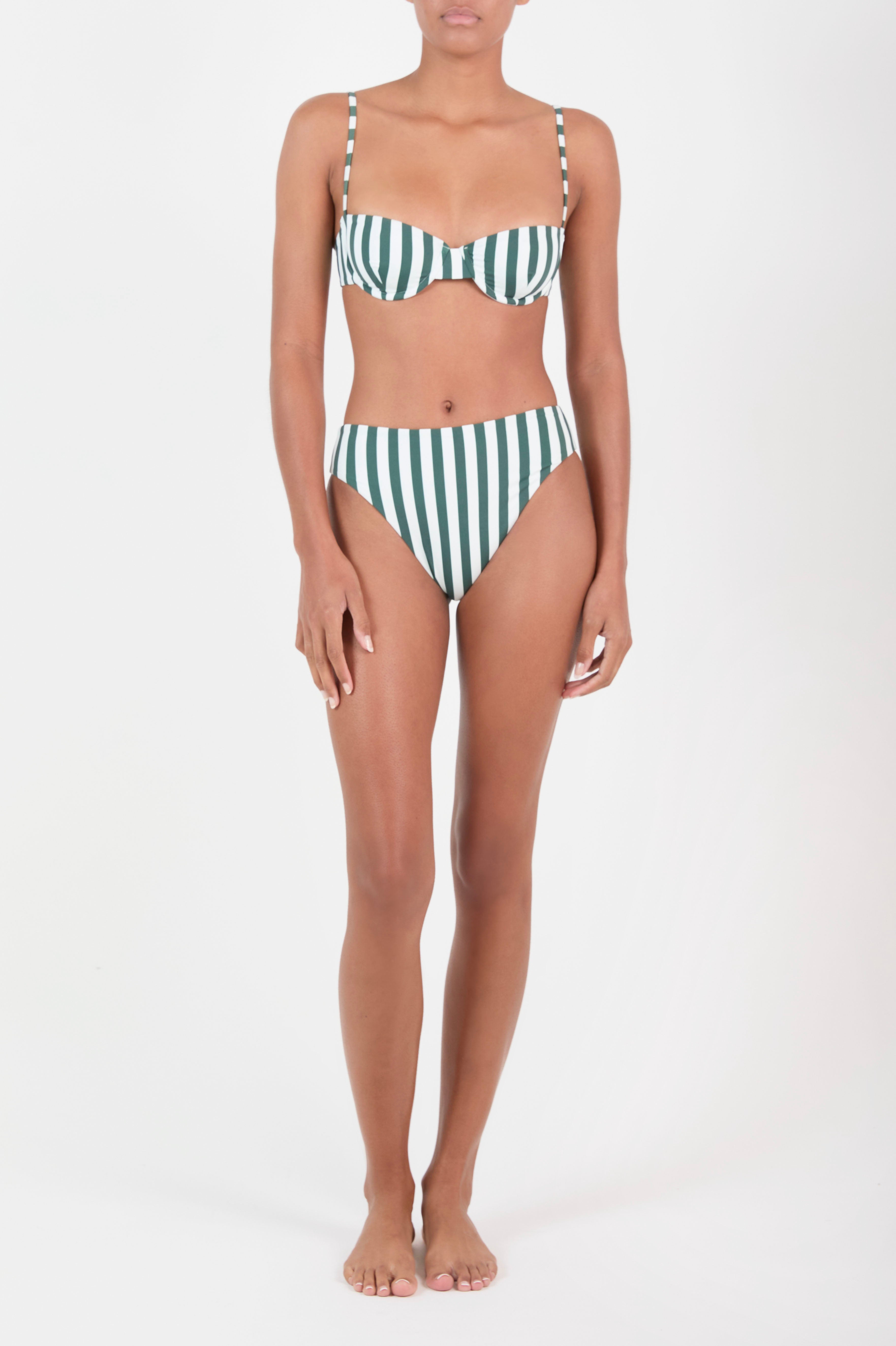 Person wearing a green and white striped bikini on a white background