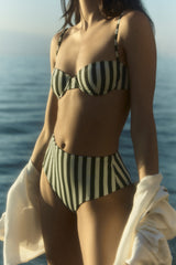 Model wearing the Balconette Underwire Bikini Top in Green Vertical Stripes, designed to sit straight across the chest, it features light support and adjustable straps.
