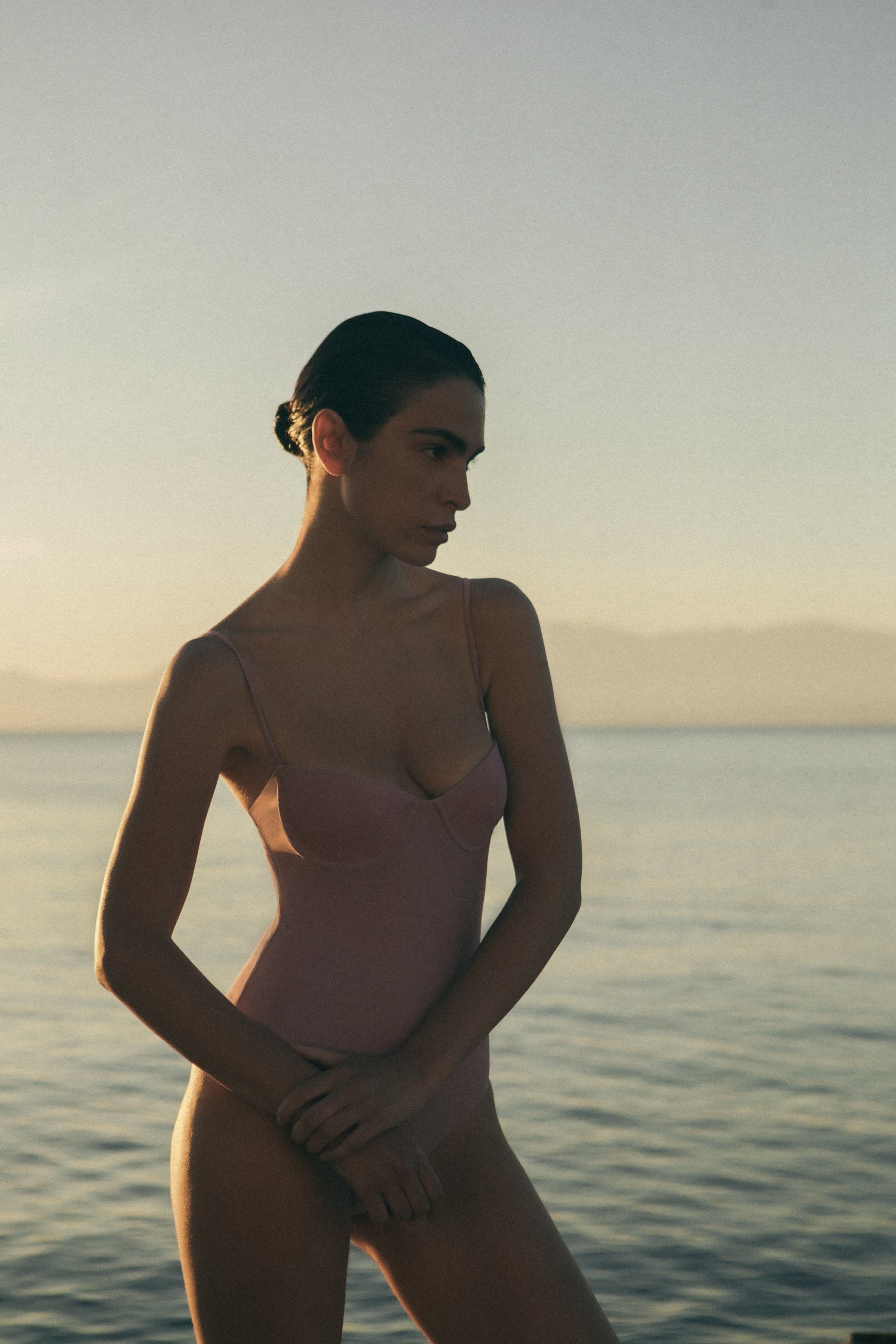 Model wearing the Balconette Underwire One-Piece, featuring underwire support, adjustable straps, and a clean, 90s-inspired silhouette.