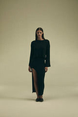 Model wearing the Bell Sleeve Boxy Crop Sweater in Modal Knit, featuring a dynamic wide sleeve and modern cropped fit, offering versatile styling options for cooler weather.