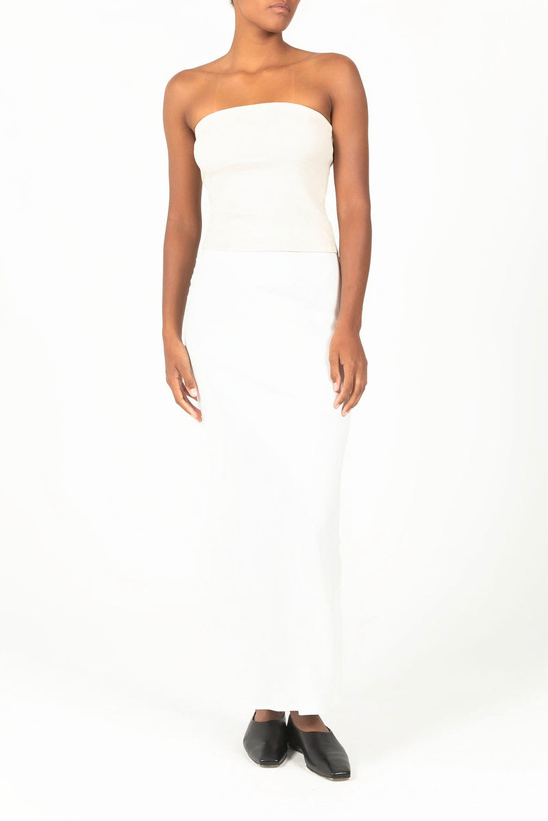 Ecomm Model wearing the Bias-Cut Maxi Skirt in Stretch Twill White, a longer version of the best-selling Rey Bias-Cut Skirt, bringing an athleticism and sultriness to this classic silhouette.