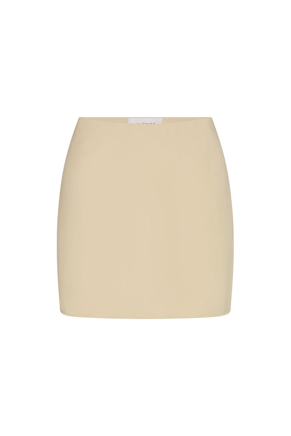 Bias-Cut Mini Skirt in fluid stretch sateen on a white background. Sleek, versatile, and perfect for elevated everyday or evening wear.