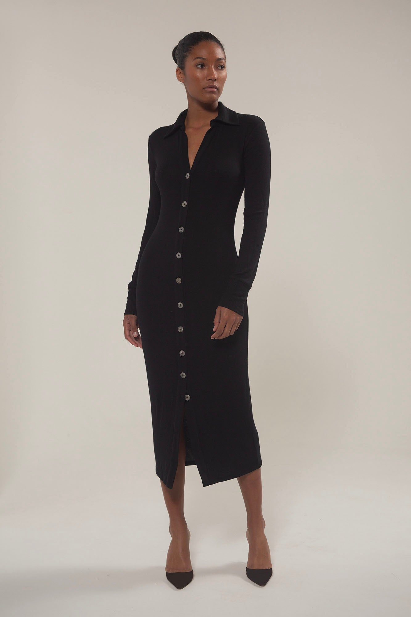 Cardigan Midi Dress in Modal Knit Black on Model with natural mother-of-pearl buttons and the distinctive midi hem length, this look gives you coverage that feels uniquely modern.  