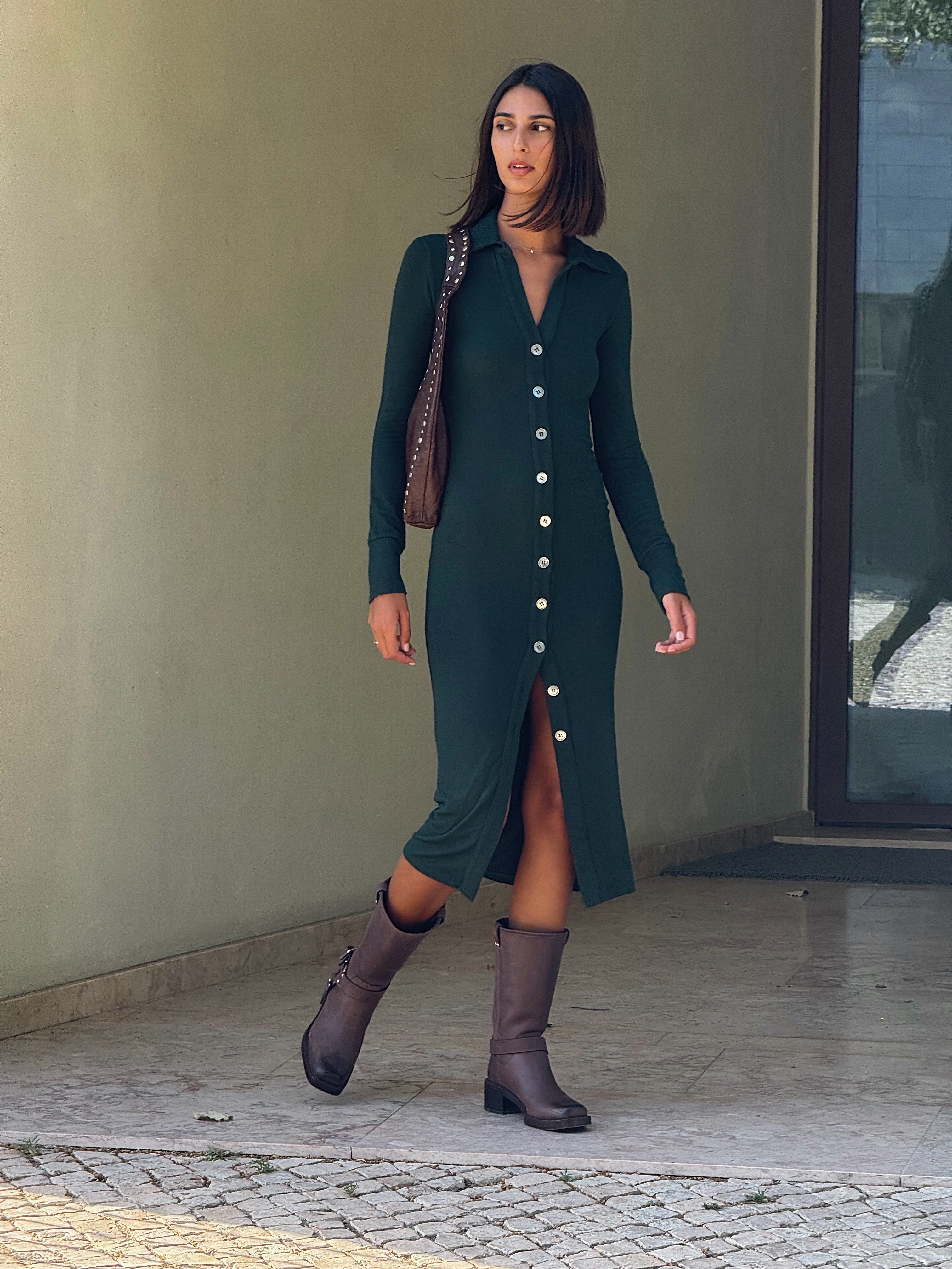 Cardigan Midi Dress in Modal Knit Dark Green on Model with natural mother-of-pearl buttons and distinctive midi hem length, this look gives you coverage that feels uniquely modern.  