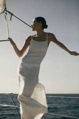 Model wearing the Column Sliding Strap Maxi Dress in Textured Stretch, updated a side slit for added movement and crafted from textured stretch fabric that works with all of your curves and flatters any body type.