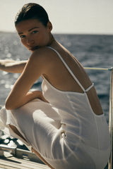 Model wearing the Column Sliding Strap Maxi Dress in Textured Stretch, updated a side slit for added movement and crafted from textured stretch fabric that works with all of your curves and flatters any body type.