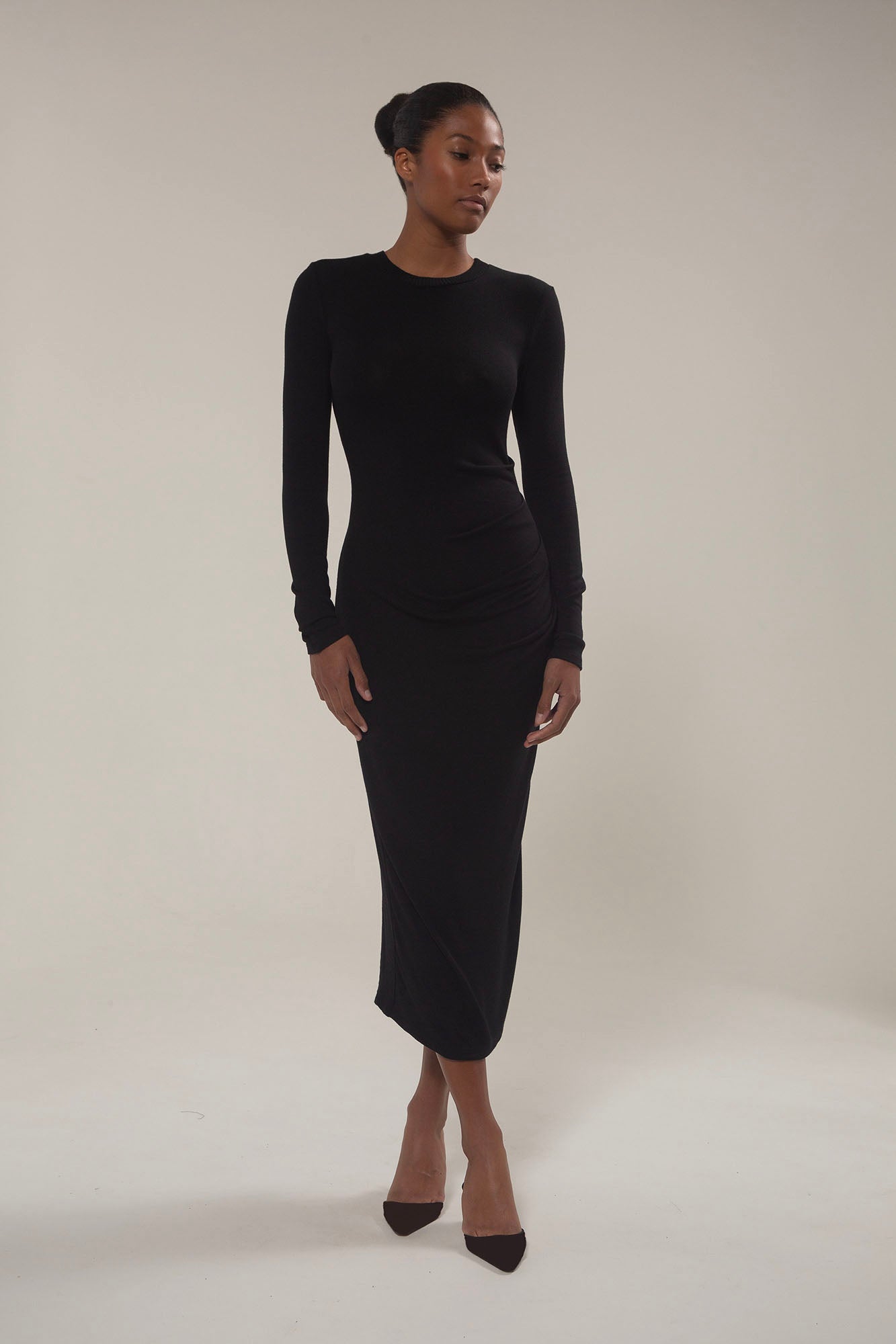 Draped Midi Dress in Modal Knit Black on Model with a long sleeve and distinctive draping, this look gives you coverage that feels uniquely modern.  