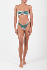 Ecomm Model wearing the Eighties High-Cut Bikini Bottom in Green Vertical Stripes featuring a flattering high-cut leg and a bold, retro-inspired silhouette. It’s updated with new stripe styles inspired by classic beach umbrellas and chaise lounges.
