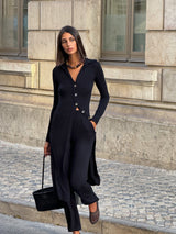 Model wearing Flared Pant in Modal Knit Black with fit and certainty of a trouser combine with the ease of a lightweight woven fabric for an inspired fall staple you will keep coming back to. 