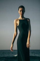 Model wearing the Gisele Bias Cut Dress in Stretch Twill, with a fabric that hugs and flatters the natural curves of any figure while the geometric bust line is relaxed yet precise. 