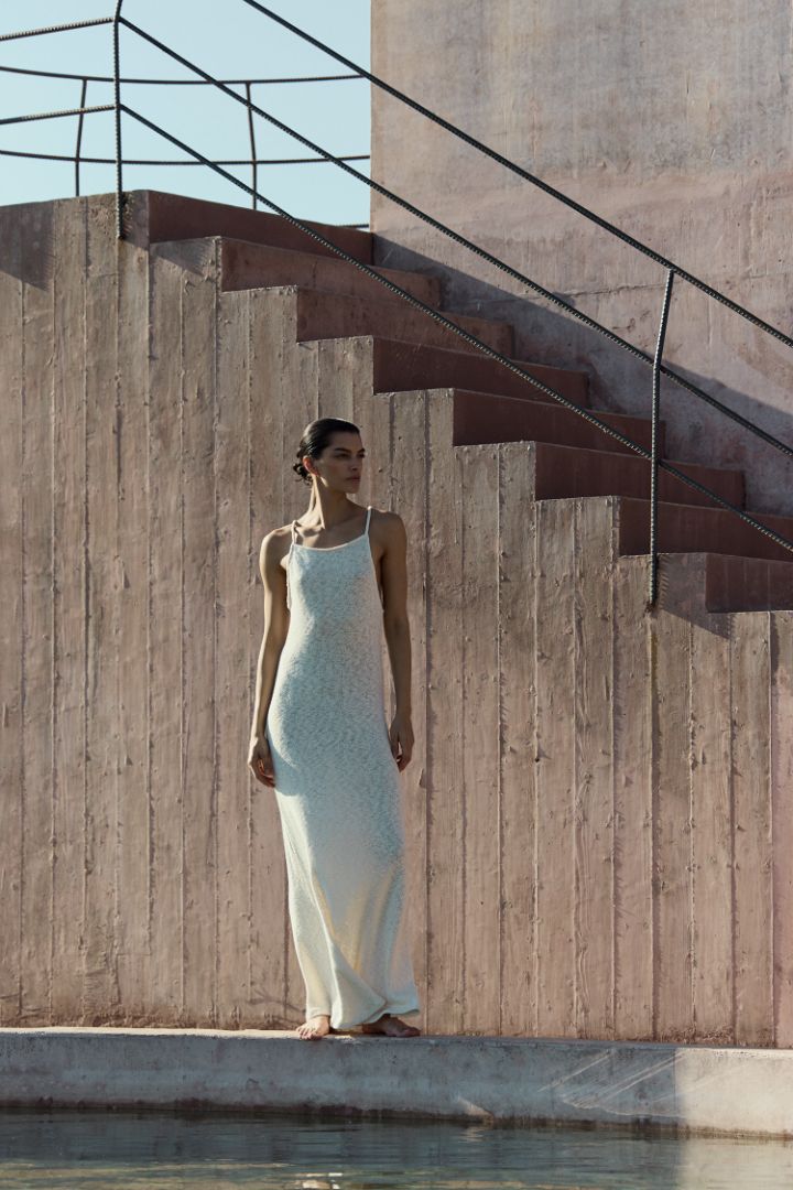 Model wearing Gisele Maxi Dress in crochet cotton knit with a breathable, lightweight texture and a relaxed, body-skimming maxi silhouette.