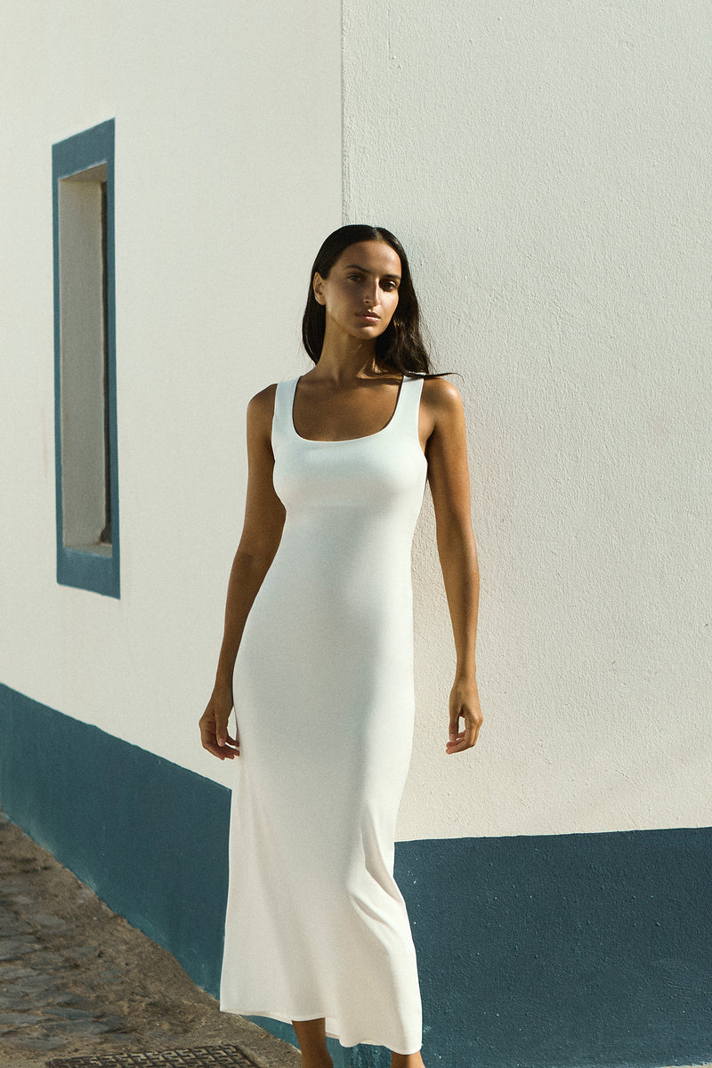 Model wearing the Hume Tank Maxi Dress White in Stretch Twill providing the simplicity of a tank top and the elegance of a maxi length