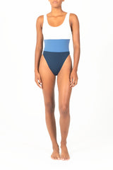 Ecomm Model wearing the Hume Tricolor One-Piece, featuring a dynamic high-cut, low-back design in two new tricolor styles.