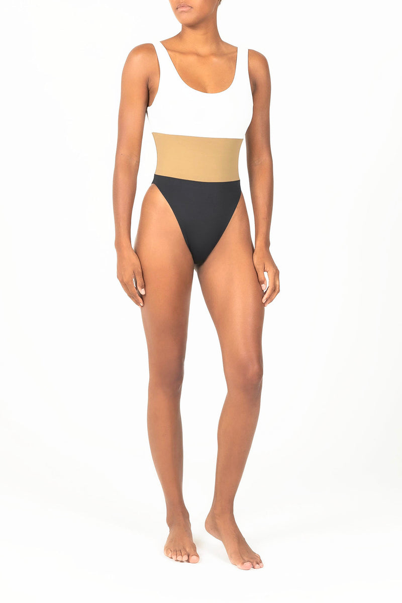 Ecomm Model wearing the Hume Tricolor One-Piece, featuring a dynamic high-cut, low-back design in two new tricolor styles.