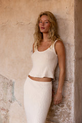 Knit tank top in cotton crochet featuring a sleeveless pullover silhouette with an open-knit texture and unlined construction. Made from soft vegan cotton blend for a lightweight, breathable fit.
