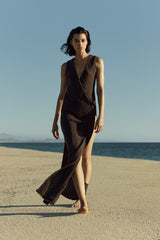 Model wearing Plunging Knot Wrap Dress in crochet cotton knit with a plunging neckline, knot detail, and draped wrap silhouette in a breathable, lightweight knit.