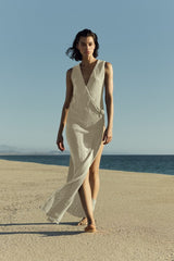 Model wearing Plunging Knot Wrap Dress in crochet cotton knit with a plunging neckline, knot detail, and draped wrap silhouette in a breathable, lightweight knit.