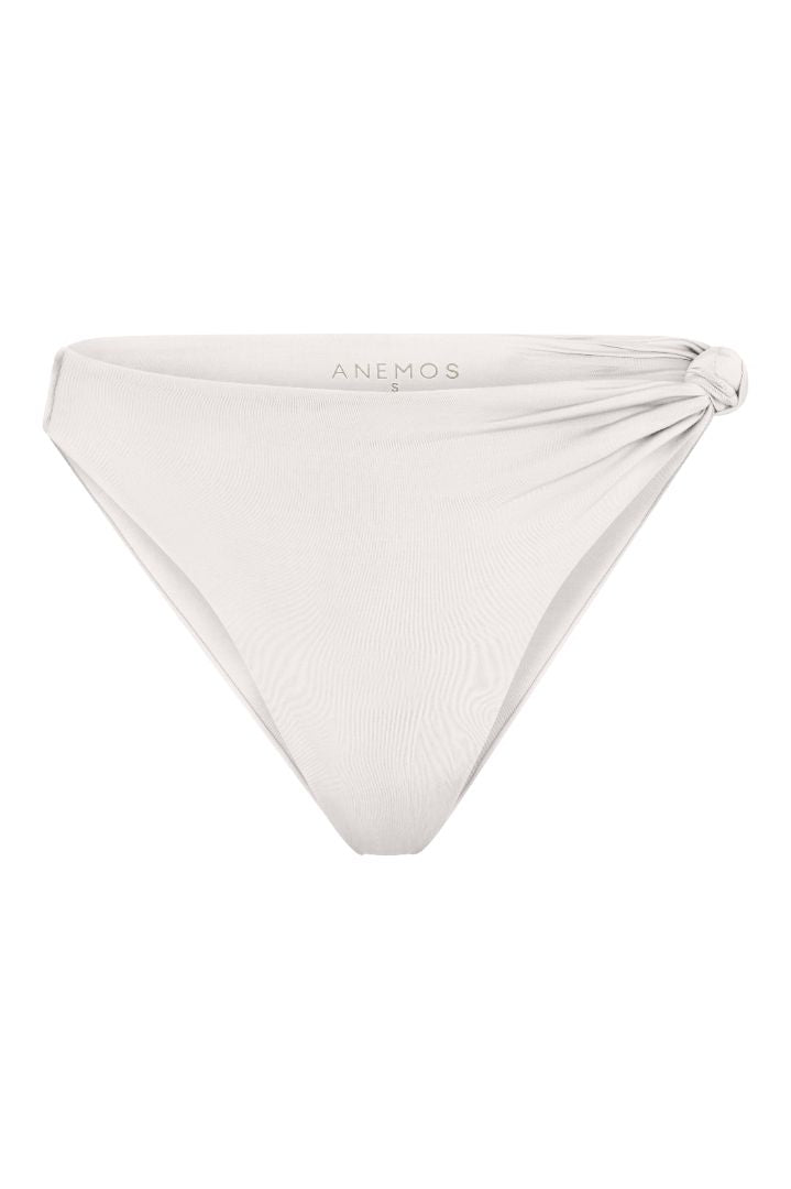 The Knot Asymmetric Midi Bikini Bottom on a white background, featuring a high-waist, high-cut leg, and knot detail at the hip for a retro-inspired, sculptural look. 