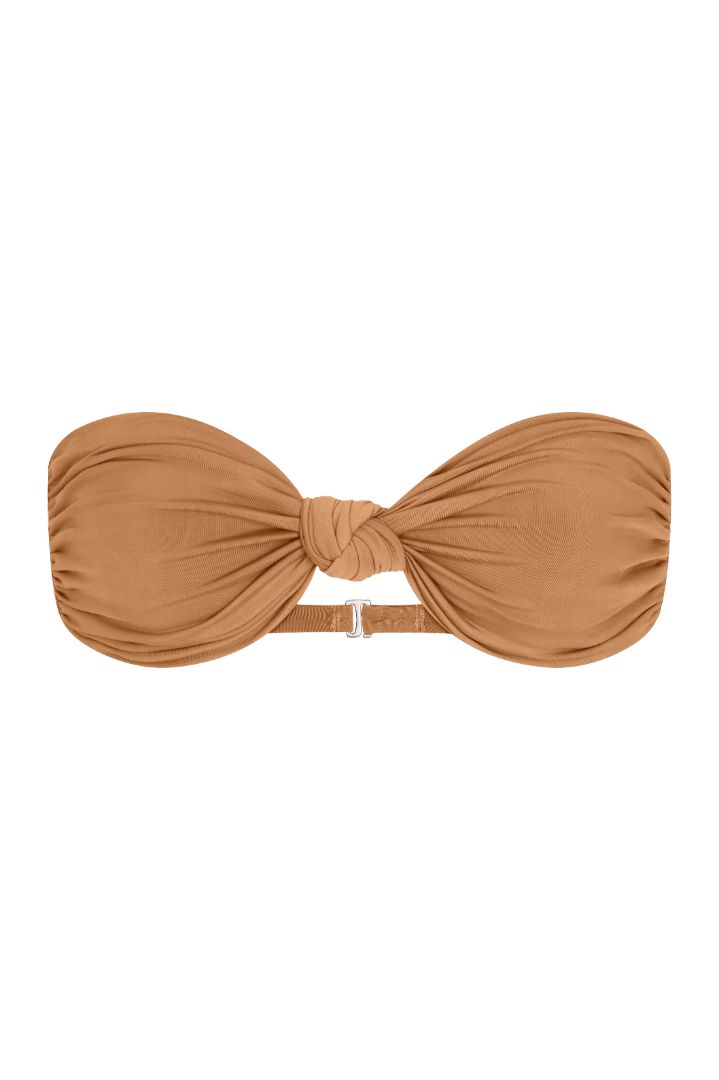 The Knot Bandeau Bikini Top on a white background, featuring a bandeau silhouette with a refined knot detail, blending ’70s glamour with ’90s simplicity. 