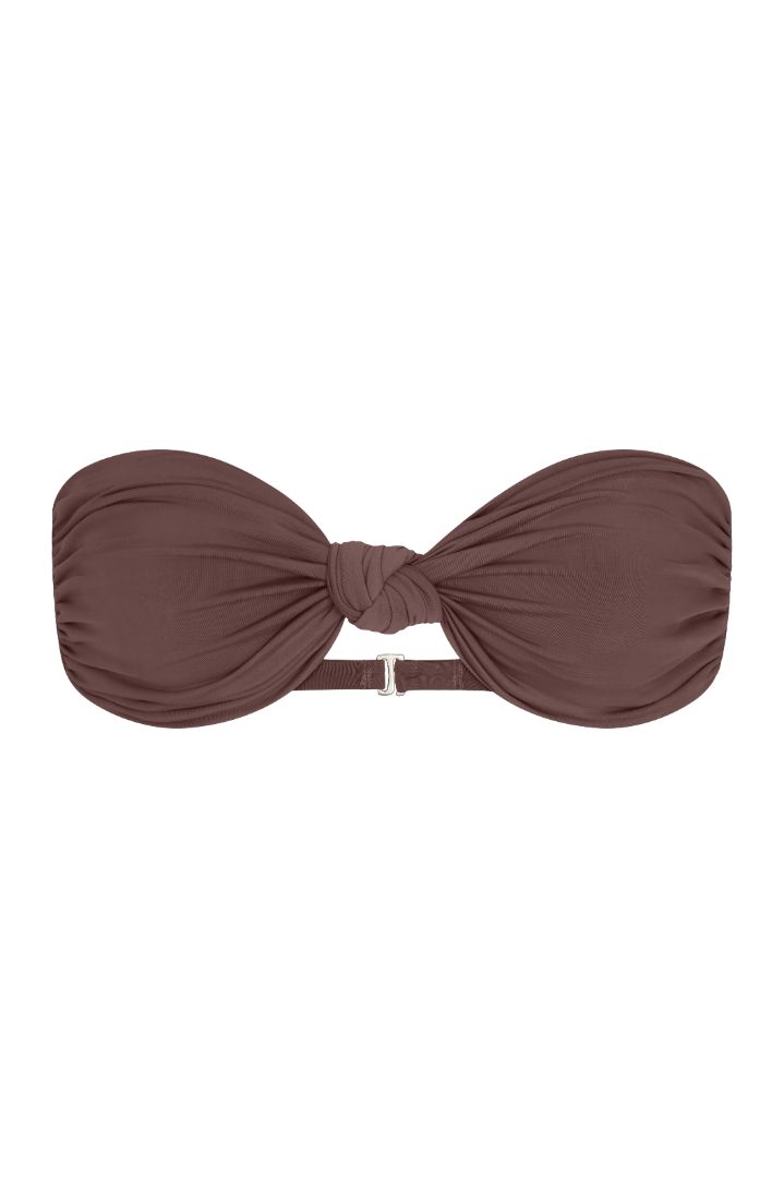 The Knot Bandeau Bikini Top on a white background, featuring a bandeau silhouette with a refined knot detail, blending ’70s glamour with ’90s simplicity. 