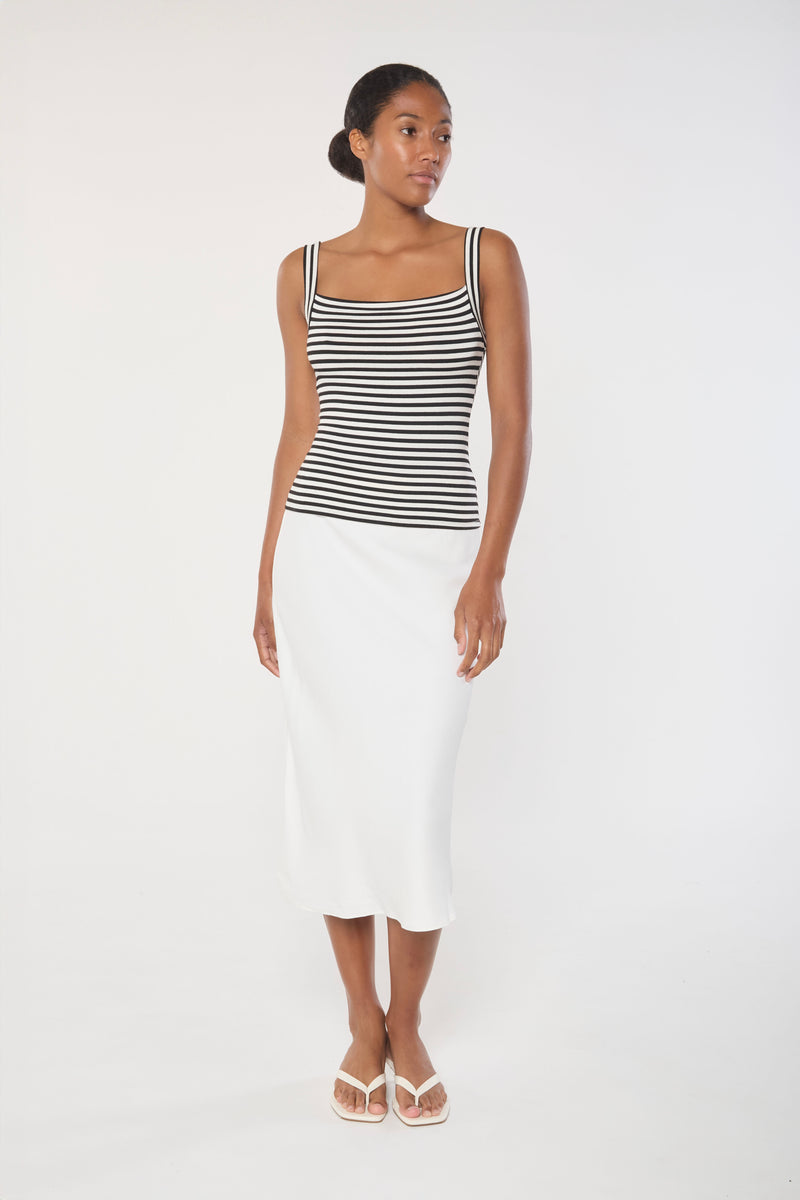 Ecomm Model wearing the Rey Bias-Cut Skirt in Stretch Twill, feauting a distinctive length and simple silhouette, in our new stretch twill fabric.