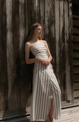 Model wearing the Ritts Strapless Top Natural Stripe in Striped Stretch Twill, offers a refined, sculpted silhouette with a sleek, minimalist finish.