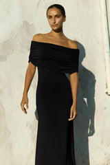 Model wearing the Ruched Off-The-Shoulder Maxi Dress black in Compact Jersey. The soft, stretchy jersey fits and flatters all curves and body types.