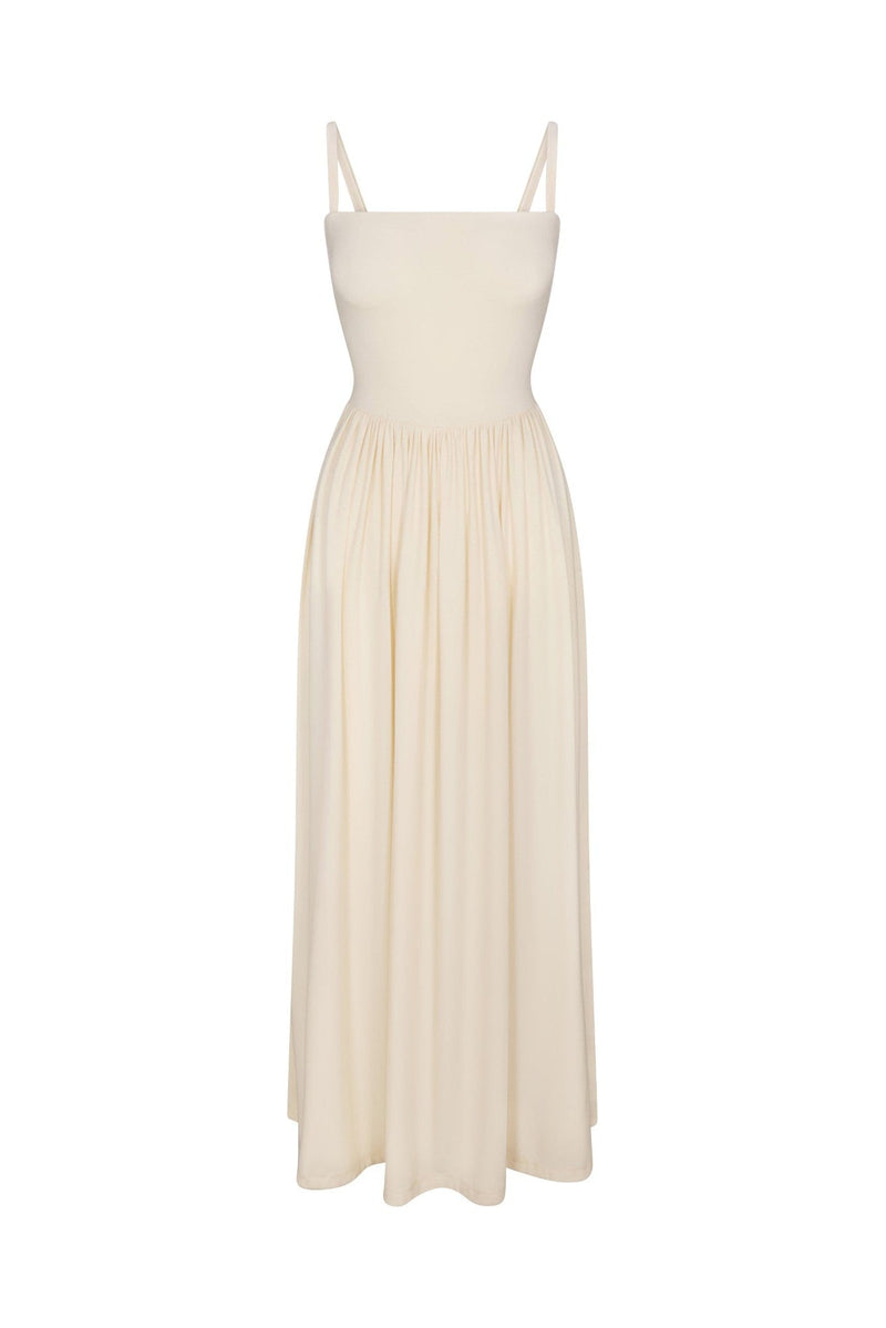 Square Neck Gathered A-Line Maxi Dress Oyster in compact jersey displayed on a white background. A flattering, minimalist and structured drape ideal for elevated everyday or resort wear.