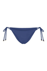String Tie Bikini Bottom on a white background, featuring adjustable side ties with petite tortoise rings and a versatile high- or low-waist fit for a sleek ’70s-inspired look. 