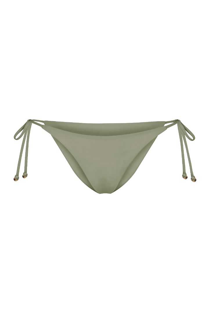 String Tie Bikini Bottom on a white background, featuring adjustable side ties with petite tortoise rings and a versatile high- or low-waist fit for a sleek ’70s-inspired look.