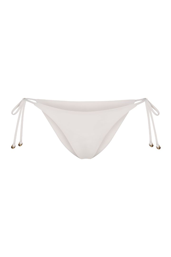String Tie Bikini Bottom on a white background, featuring adjustable side ties with petite tortoise rings and a versatile high or low-waist fit for a sleek ’70s-inspired look. 