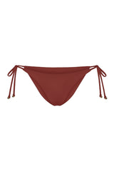 String Tie Bikini Bottom on a white background, featuring adjustable side ties with petite tortoise rings and a versatile high- or low-waist fit for a sleek ’70s-inspired look. 