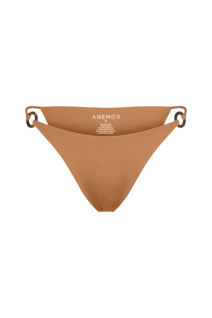 Tortoise Ring String Tie Bikini Bottom with adjustable side ties, recycled tortoise ring accents, and a flattering high-cut silhouette.