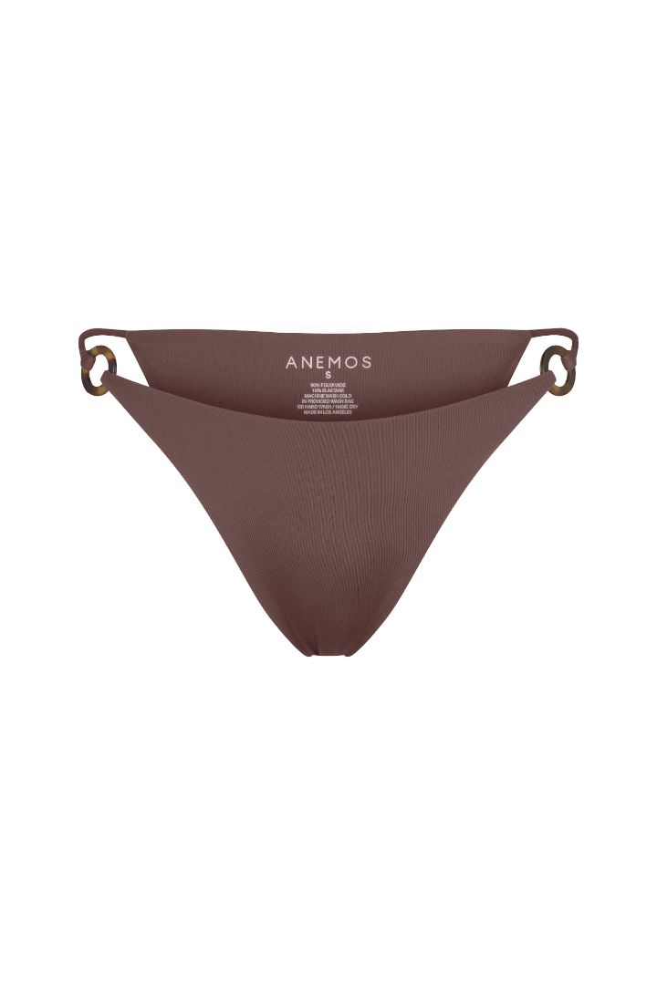 Tortoise Ring String Tie Bikini Bottom with adjustable side ties, recycled tortoise ring accents, and a flattering high-cut silhouette.