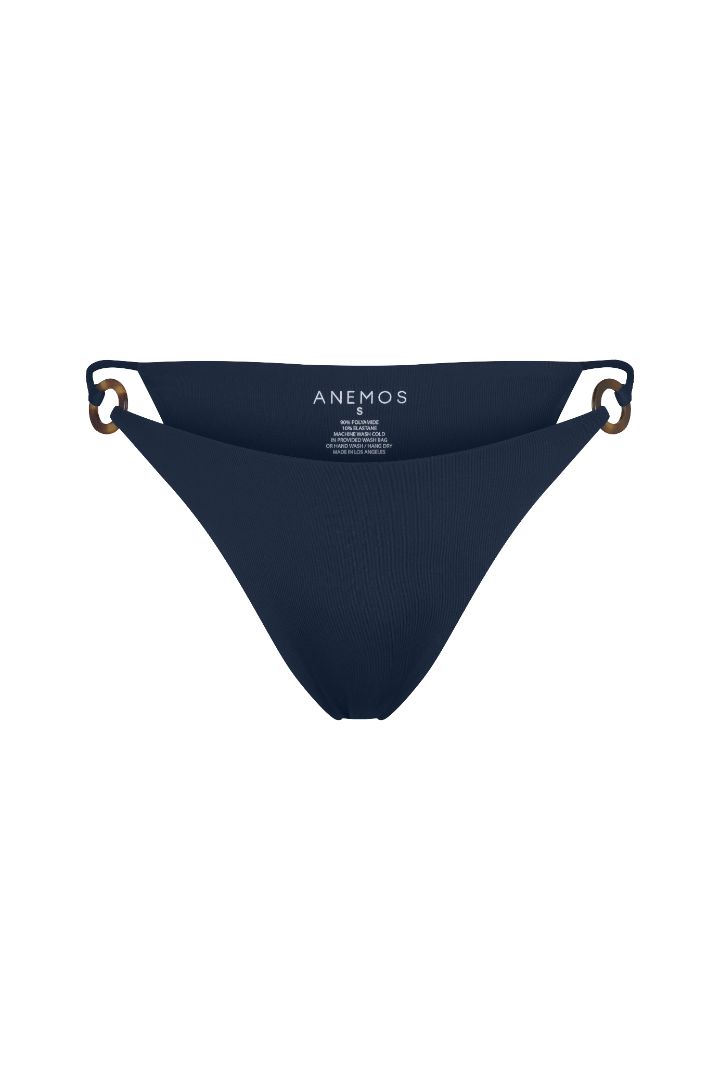 Tortoise Ring String Tie Bikini Bottom with adjustable side ties, recycled tortoise ring accents, and a flattering high-cut silhouette.
