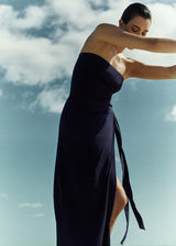 Model wearing the Wrap Tie Maxi Skirt Marine in Stretch Twill, designed with a self-tie waist that moves with ease.