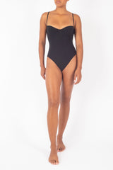 Ecomm Model wearing the Balconette Underwire One-Piece, featuring a supportive underwire, adjustable straps, and a clean, minimalist design inspired by ’90s California style.