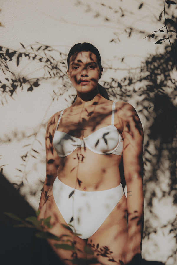 Model wearing the Brigitte Underwire Bikini Top, featuring substantial straps and a flattering full-cup silhouette perfect for any getaway.