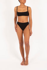 Ecomm Model wearing the Square Neck Bikini Top, featuring slimmer straps, an open back, and a horizontal bodice.