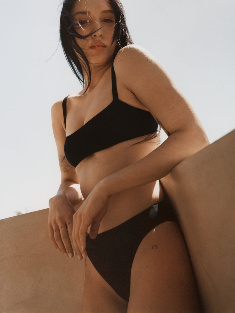 Model wearing the Square Neck Bikini Top, featuring slimmer straps, an open back, and a horizontal bodice.